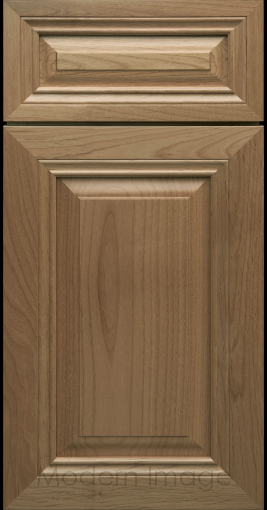 Close-up of a Warm Gray-stained wood cabinet door with a mitered frame and traditional Cambridge raised center panel.
